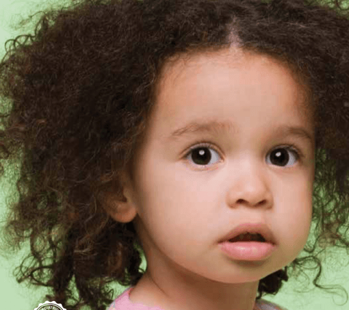 a little girl with curly hair is looking at the camera .