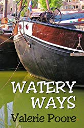 A couple of boats are docked next to each other in a body of water.