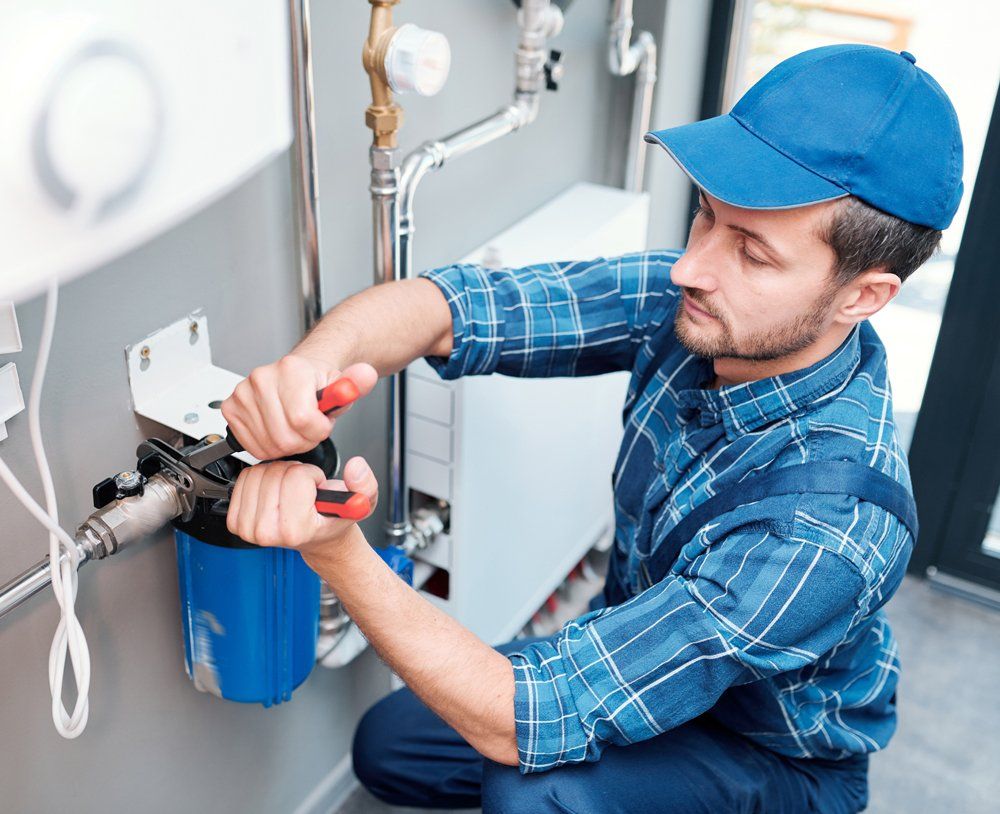 Skilled Plumber Fixing Pipe — Lansing, MI — Michigan Plumbing