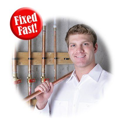 Plumber with copper pipe smiles near pipes; red 
