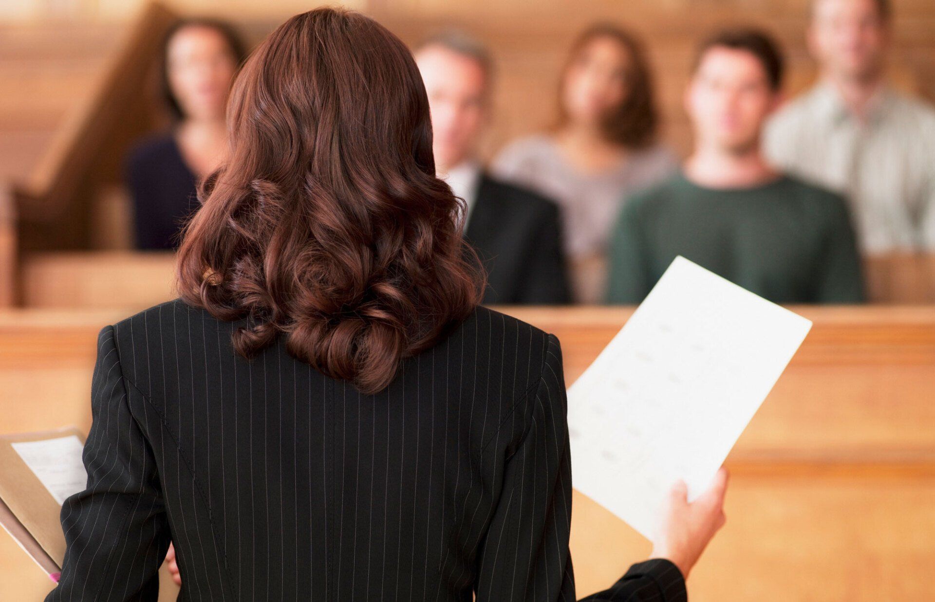 Attorney Holding Papers — Niles, MI — Gennel Laluna Schaeffer Law Attorney Holding Papers — Niles, MI — Gennel Laluna Schaeffer Law