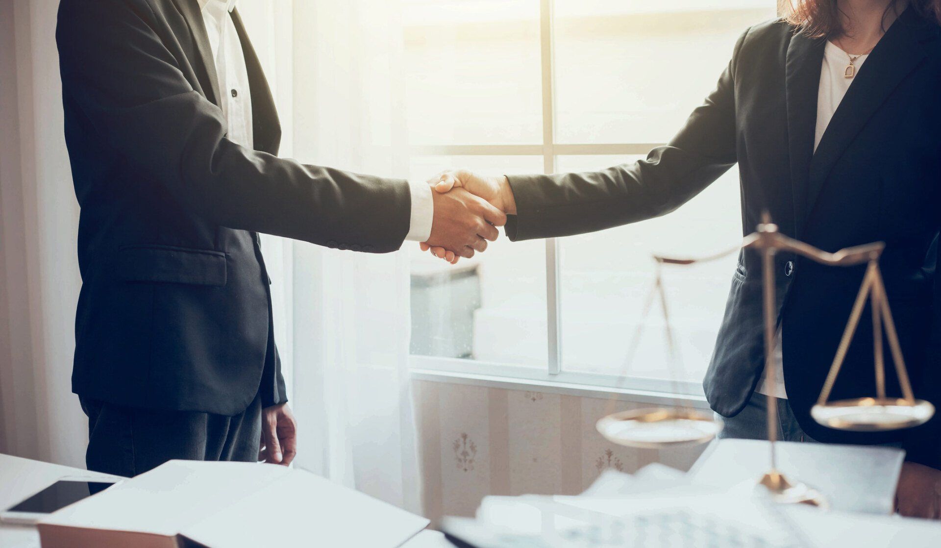Attorney Hand Shaking With Client — Niles, MI — Gennel Laluna Schaeffer Law Attorney Hand Shaking With Client — Niles, MI — Gennel Laluna Schaeffer Law
