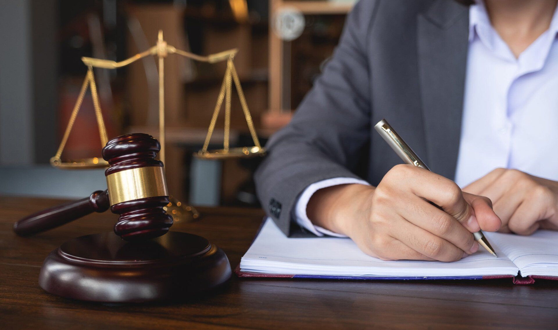 Female Attorney Writing — Niles, MI — Gennel Laluna Schaeffer Law Female Attorney Writing — Niles, MI — Gennel Laluna Schaeffer Law