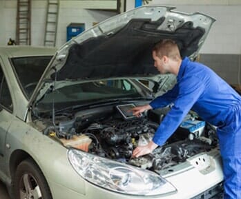 Mechanic Examining Car Engine — Differential Repairs in Denville, NJ