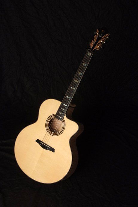 Front view Dinah in quilted maple and alpine spruce
