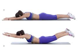 A woman is doing a exercise on a yoga mat.