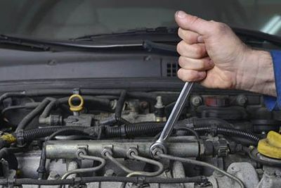 Hand of auto mechanic with a wrench Hand of auto mechanic with a wrench
