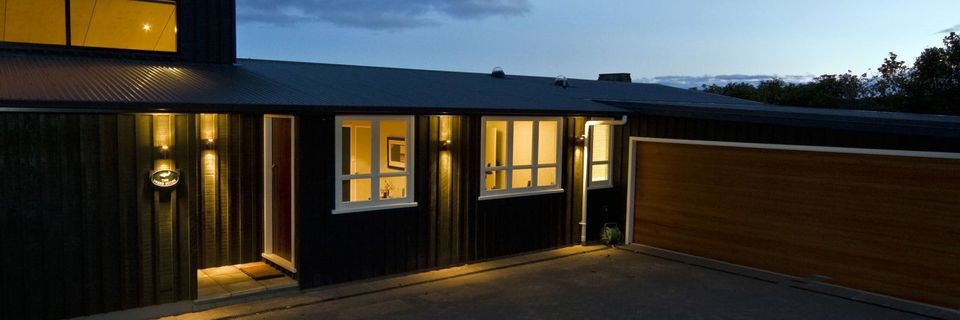 Nightfall over a house built by a master builder in Taupo