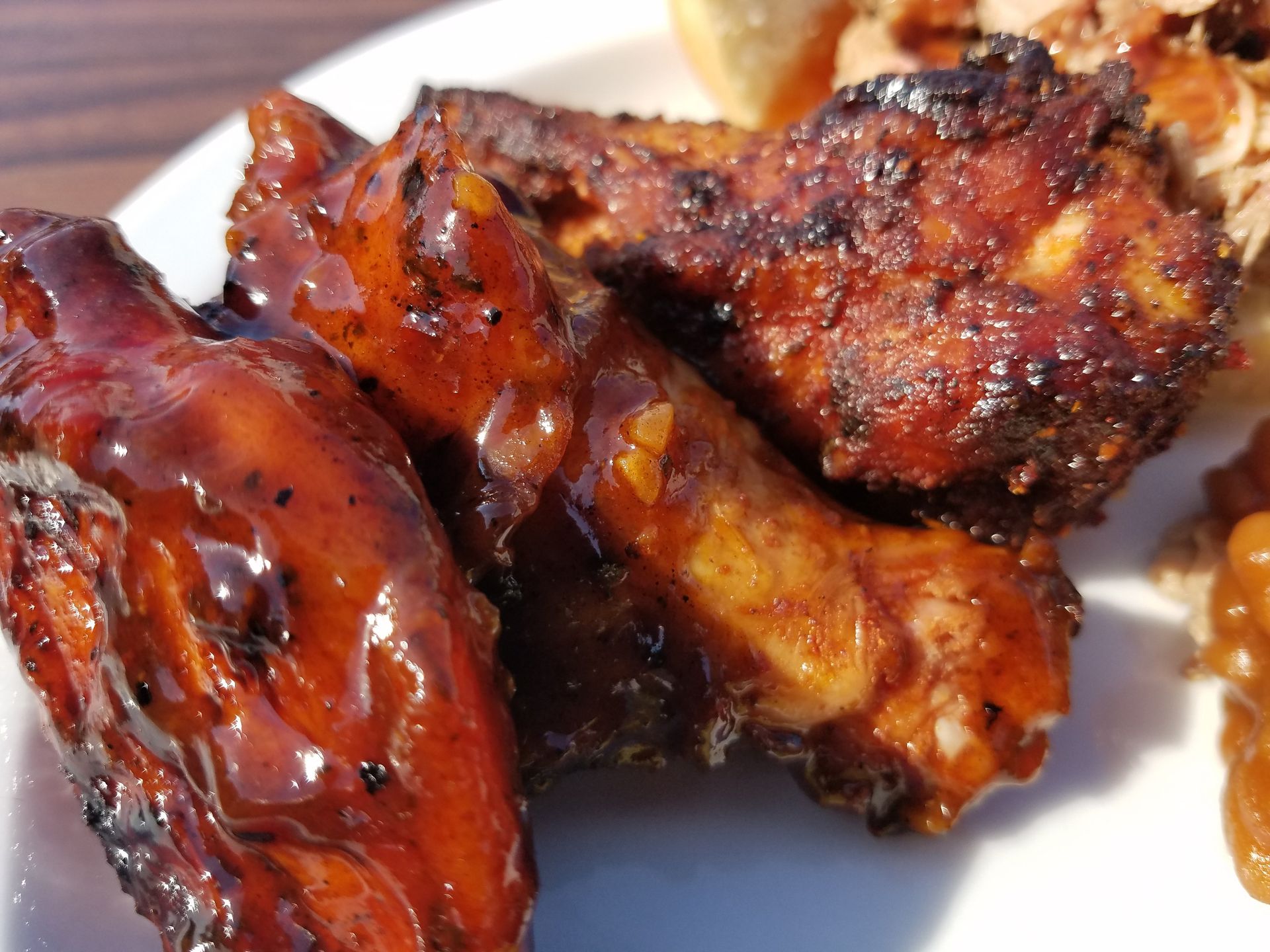 A close up of chicken wings on a white plate