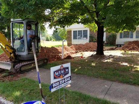 Licensed Plumber — Man Twisting the Light Bulb in Hillsborough, NJ