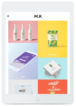 Tablet displaying a portfolio website with product mockups and design examples.