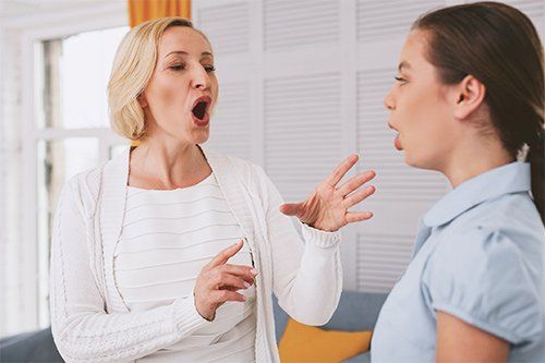 Vocal Coach Practicing With Her Student