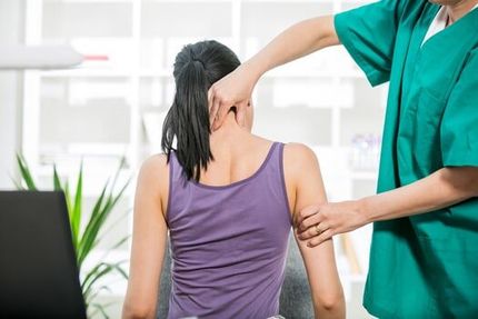 Chiropractor Stretches Female Patient Neck Muscles - Chiropractic Services in Anderson, SC Chiropractor Stretches Female Patient Neck Muscles - Chiropractic Services in Anderson, SC