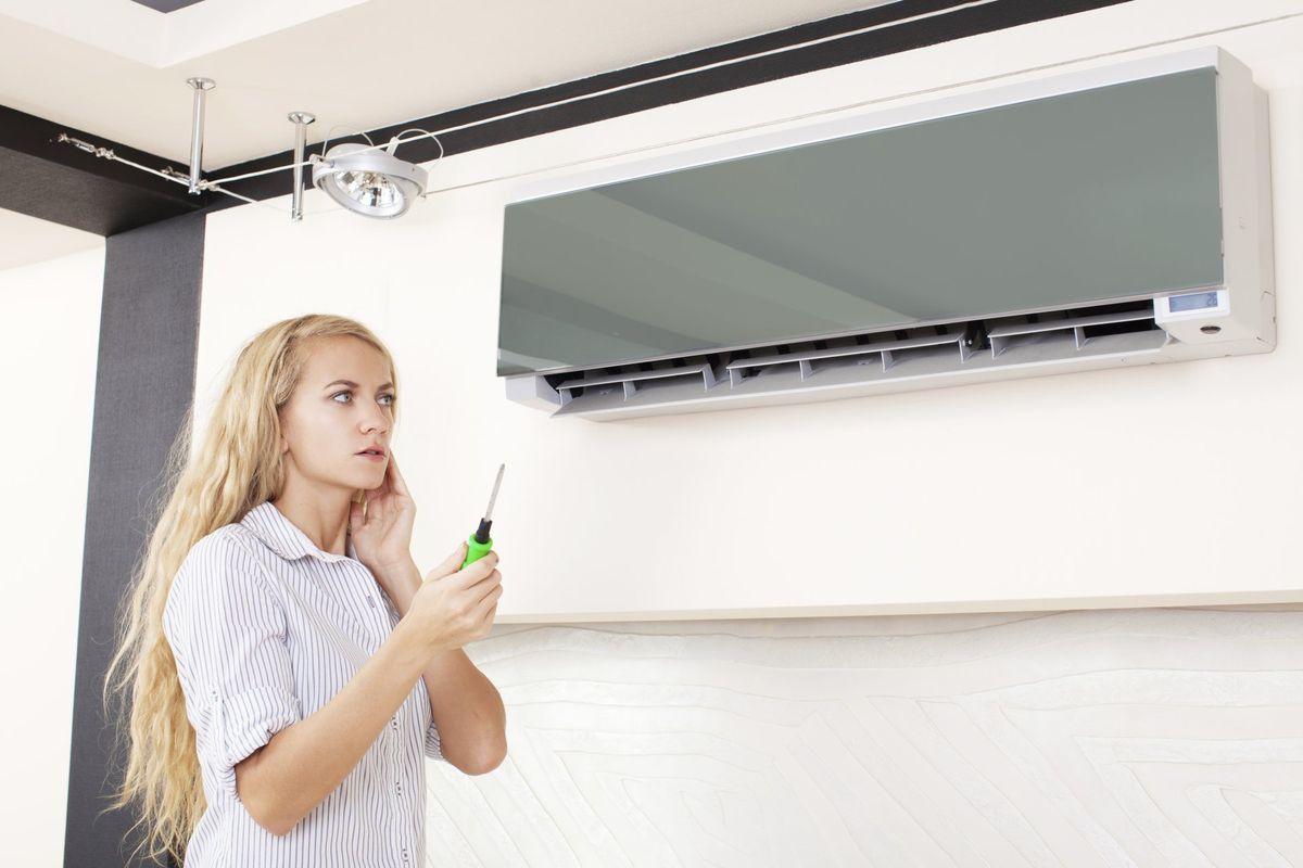 Air Conditioning Repair — Woman Under Air-condition in Hampton Roads, VA Air Conditioning Repair — Woman Under Air-condition in Hampton Roads, VA
