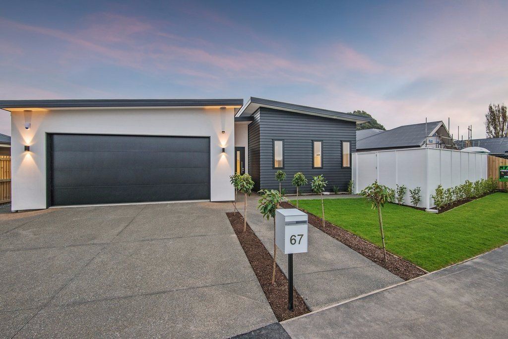 Exterior of house with outdoor lighting and security camera