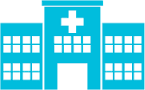 A blue hospital building with a white cross on top of it.