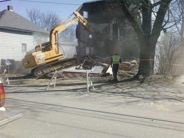House Demolition Using Excavator Truck — Bangor, ME — Hughes Bros Inc