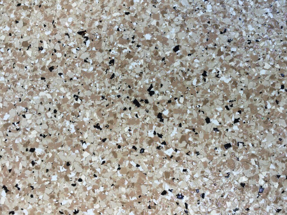 Sandstone flake color sample for polyaspartic garage flooring
