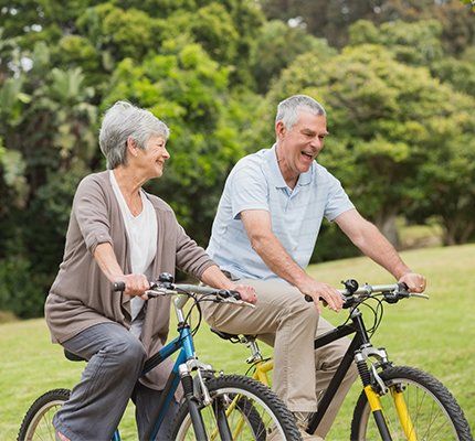 Psychotherapy — Happy Couple Biking in the Park in Grand Forks, ND