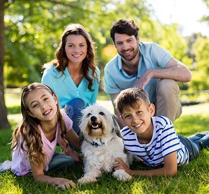 Adoption — Happy Family with their Dog in Grand Forks, ND Adoption — Happy Family with their Dog in Grand Forks, ND