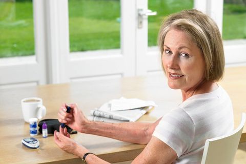 Woman Checking Her Sugar Level — Big Rapids, MI — Crew & Boss Eye Associates