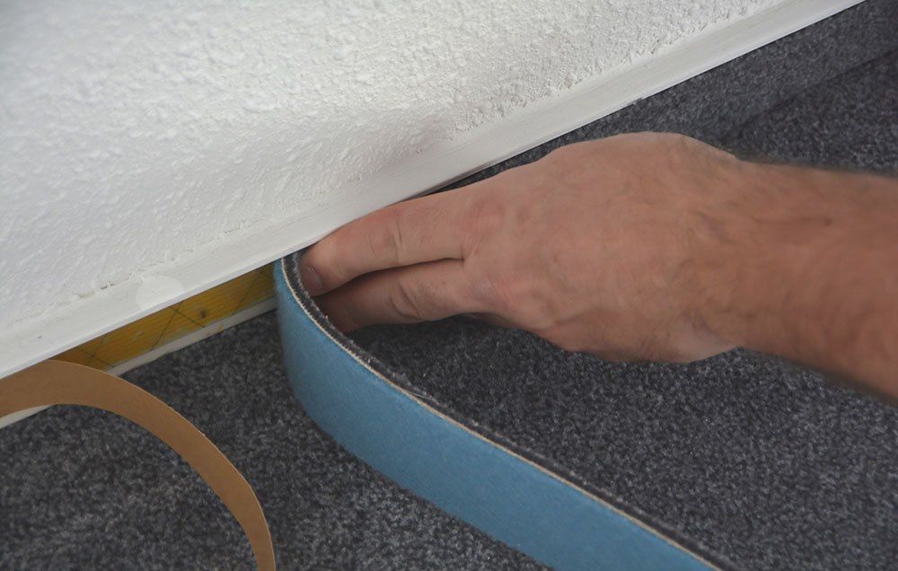 Laying carpet trim laying carpet trim