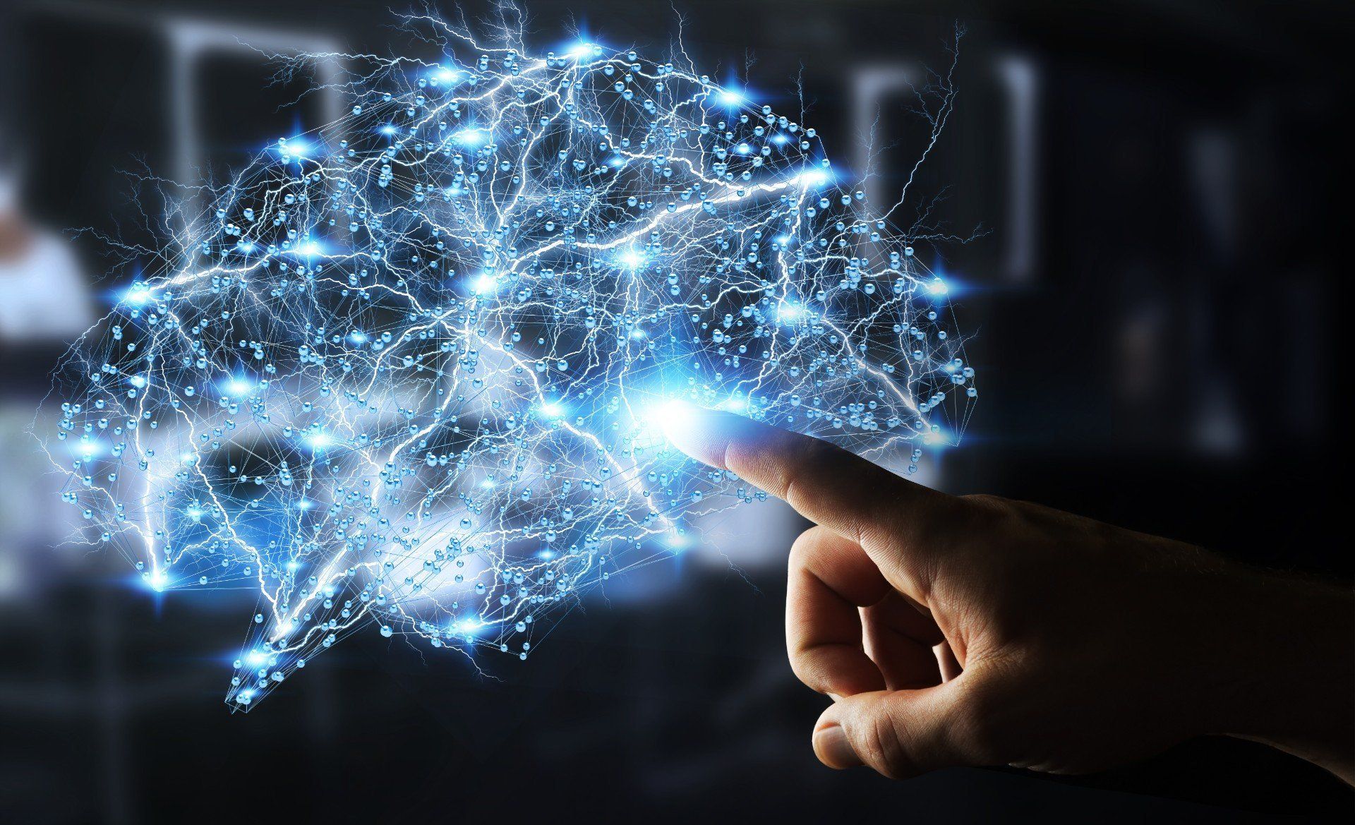 Immagine virtuale di cervello stilizzato e dito umano