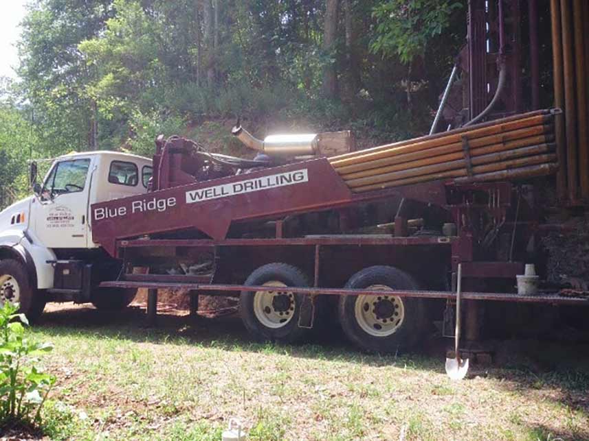 Red truck — pump installation in Hot Springs, NC