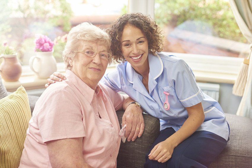 a senior woman in her home with her home carer