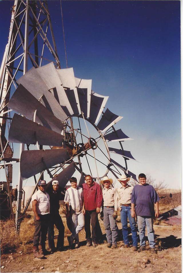 workers standing with windmill