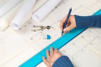 Surveying Services — Hand Holding A Drawing Pen in Latham, NY Surveying Services — Hand Holding A Drawing Pen in Latham, NY