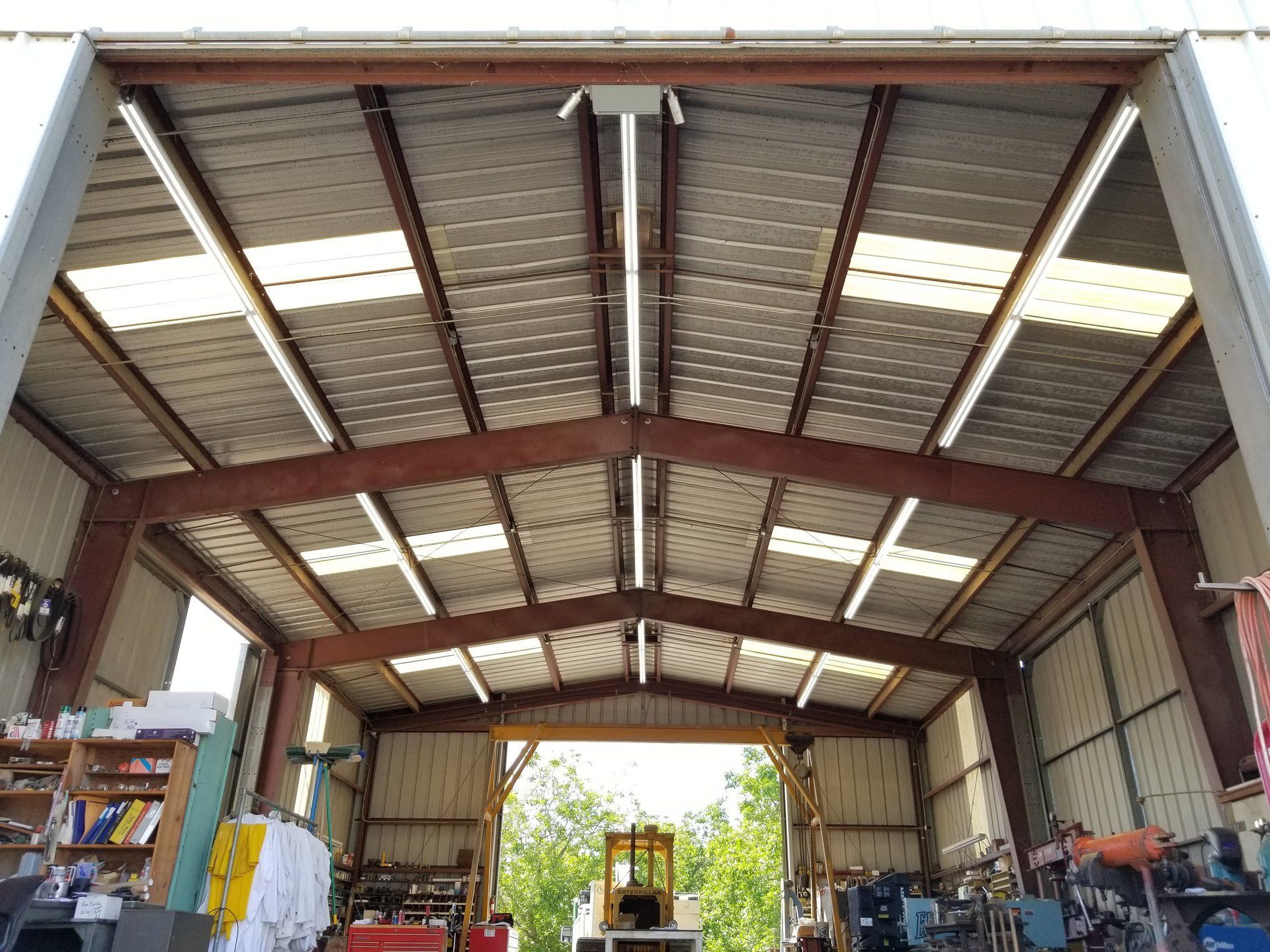 A large warehouse with a lot of machinery inside of it.