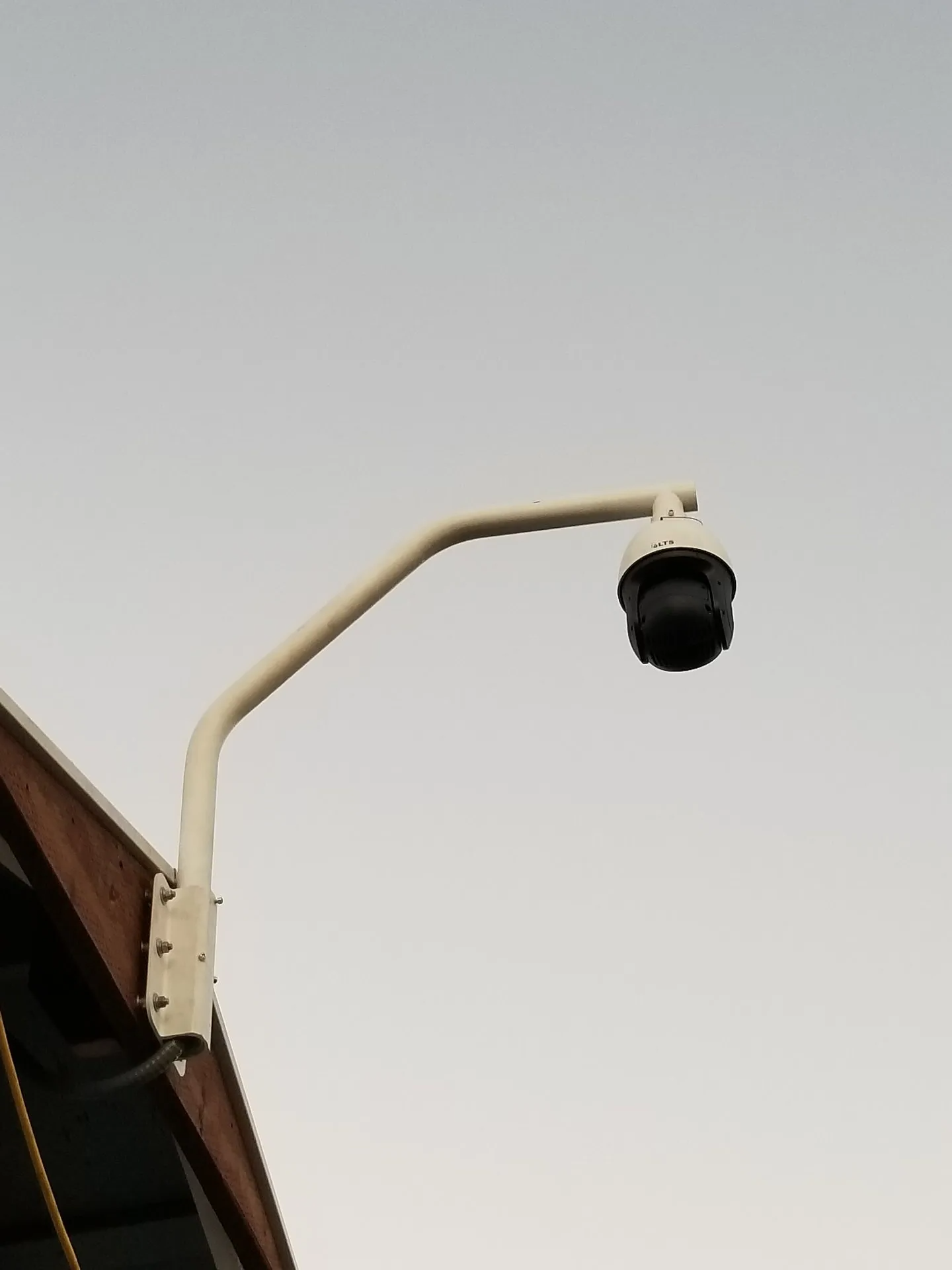 A security camera mounted on the side of a building