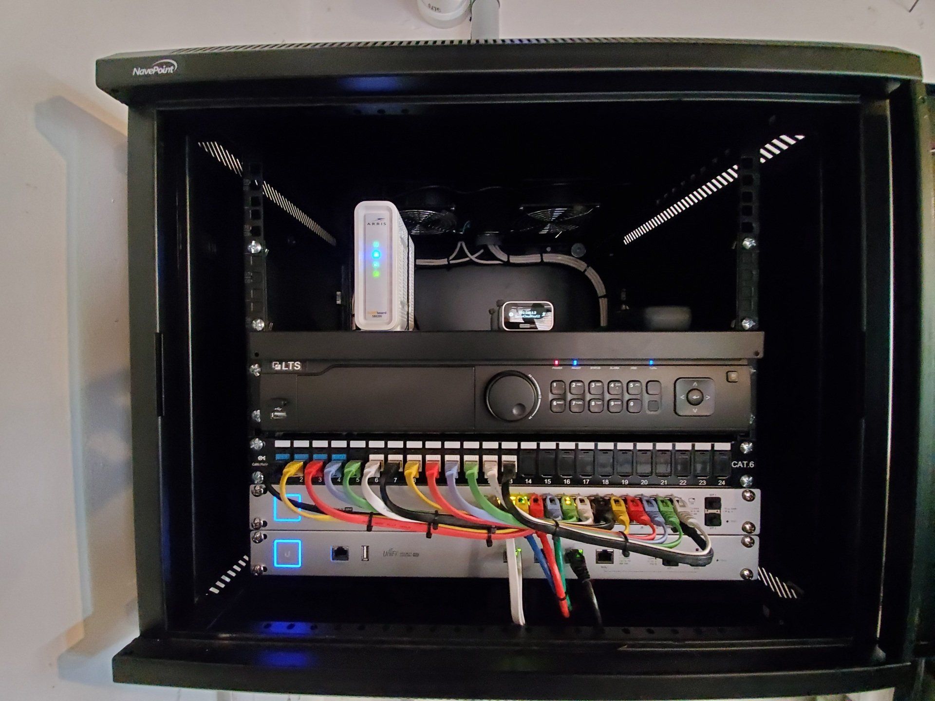 A black networking cabinet, EMS Electrical install and programs networking equipment