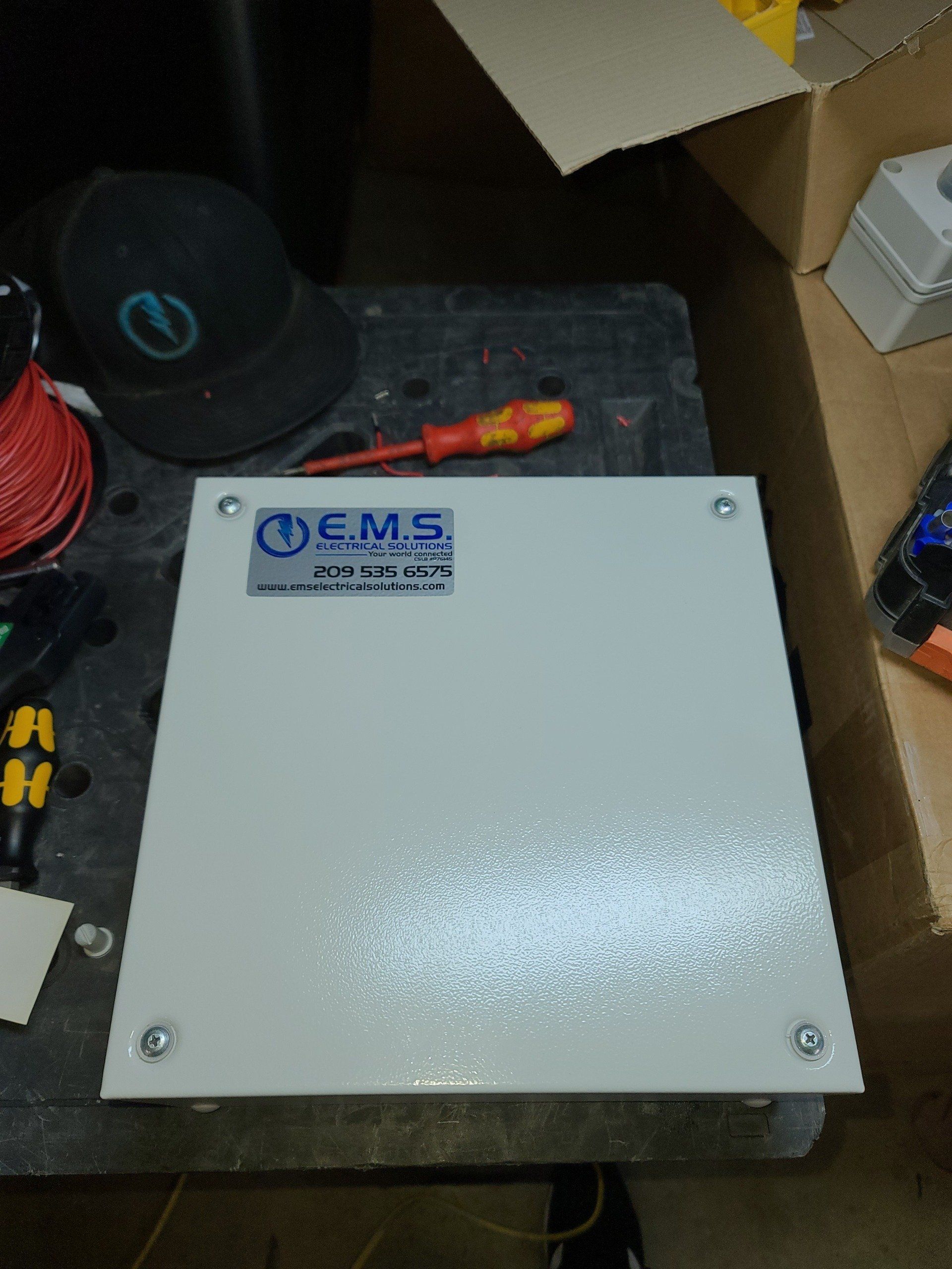 A white box with the word cms on it