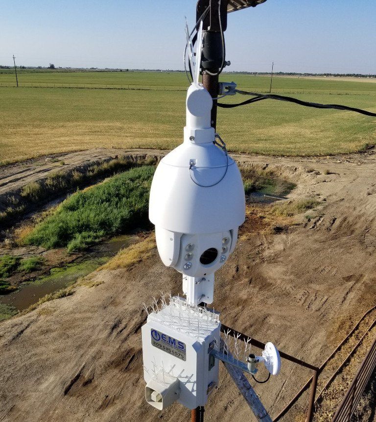 An aerial view of a dome camera on a pole