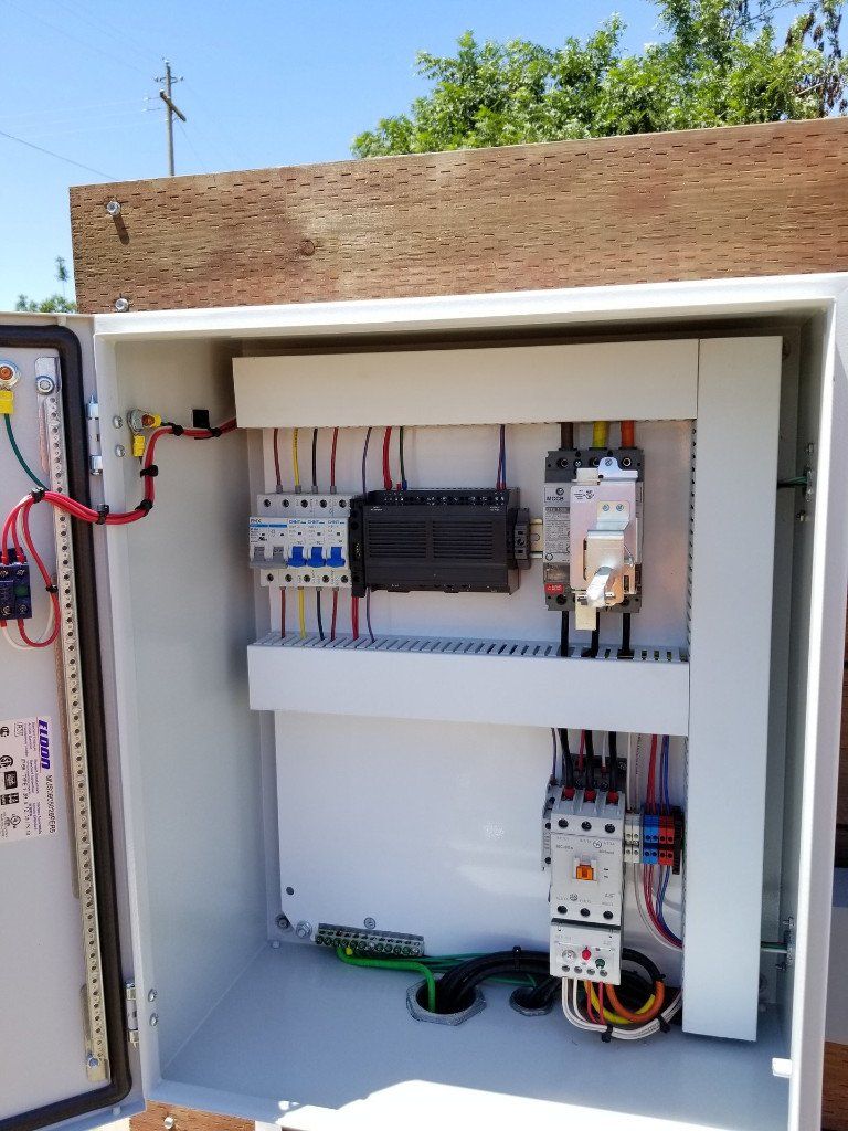 A white box with electrical equipment inside of it