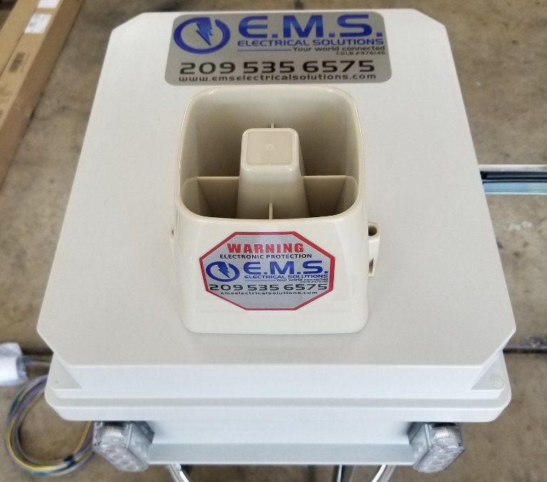 A white box with a warning sticker on it