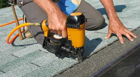 Man Installing Shingles to a Roof — Binghamton, NY — Robert J Green & Son Man Installing Shingles to a Roof — Binghamton, NY — Robert J Green & Son
