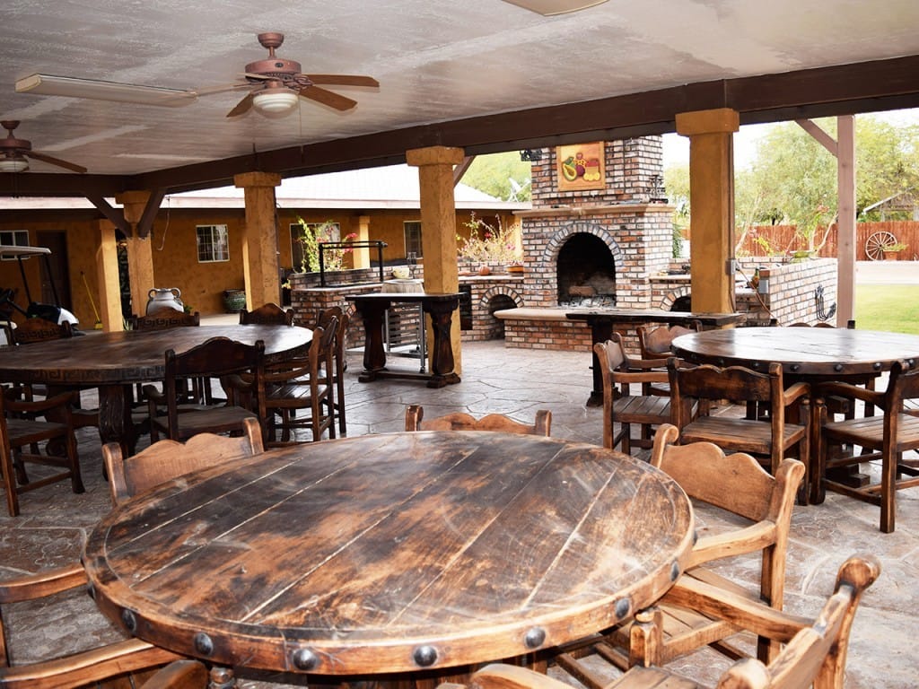 Circular Wooden Tables with Chairs Outside — Imperial, CA — NS Construction