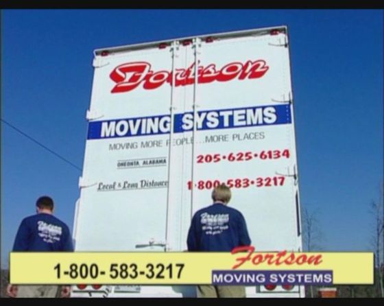 Moving Workers — Two Men Standing at the Back of the Truck in Oneonta, AL