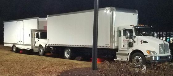 Motorcycle Transport Company — Two White Delivery Truck in Oneonta, AL