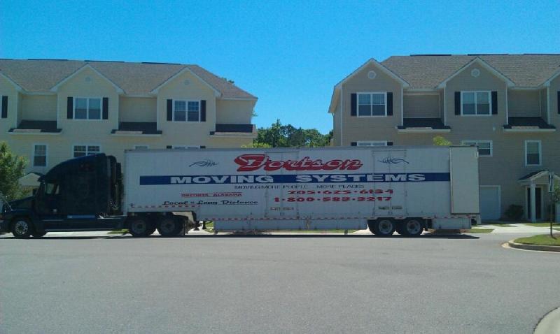 Residential Movers — Wide Moving Truck at Residential House in Oneonta, AL Residential Movers — Wide Moving Truck at Residential House in Oneonta, AL