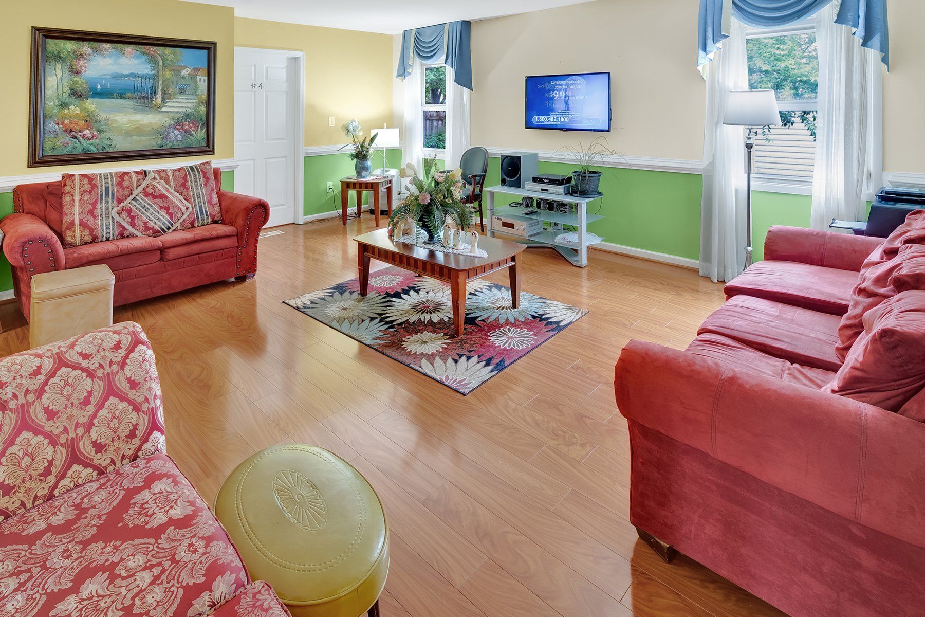 A living room filled with furniture and a television.