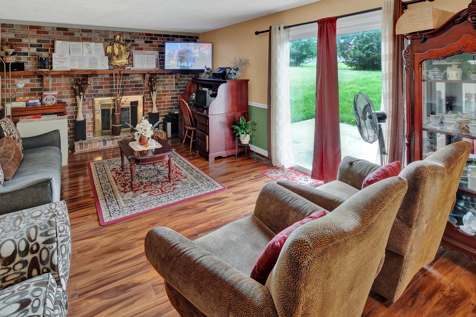 A living room filled with furniture and a fireplace.