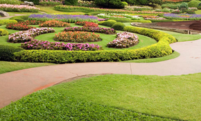 Beautifully landscaped gardens Gardens with flowers and lush grass