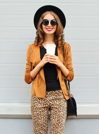 A lady holding coffee