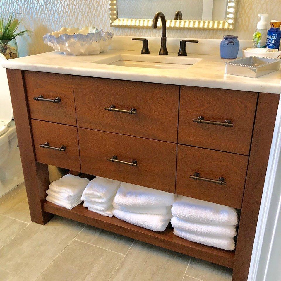 Wood Fabrication — Clean Towels Inside Cabinet in Lakewood, NJ