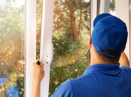 Window Replacement — Worker Installing A Window In Columbus, OH Window Replacement — Worker Installing A Window In Columbus, OH