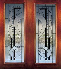 Two decorative stained-glass window panels with geometric gray, black, and red patterns in wooden frames
